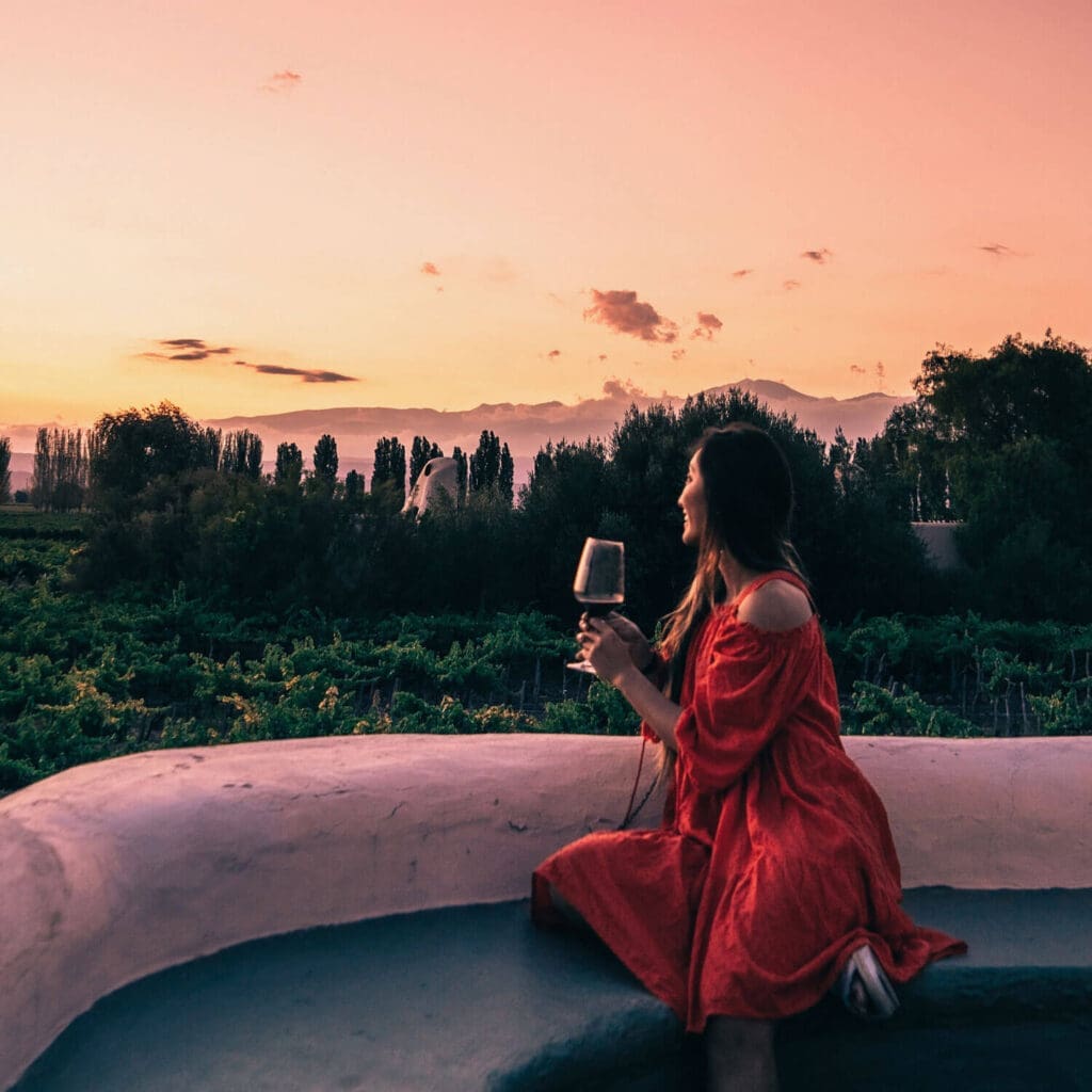 Girl drinking wine at a luxury hotel in Mendoza Argentina