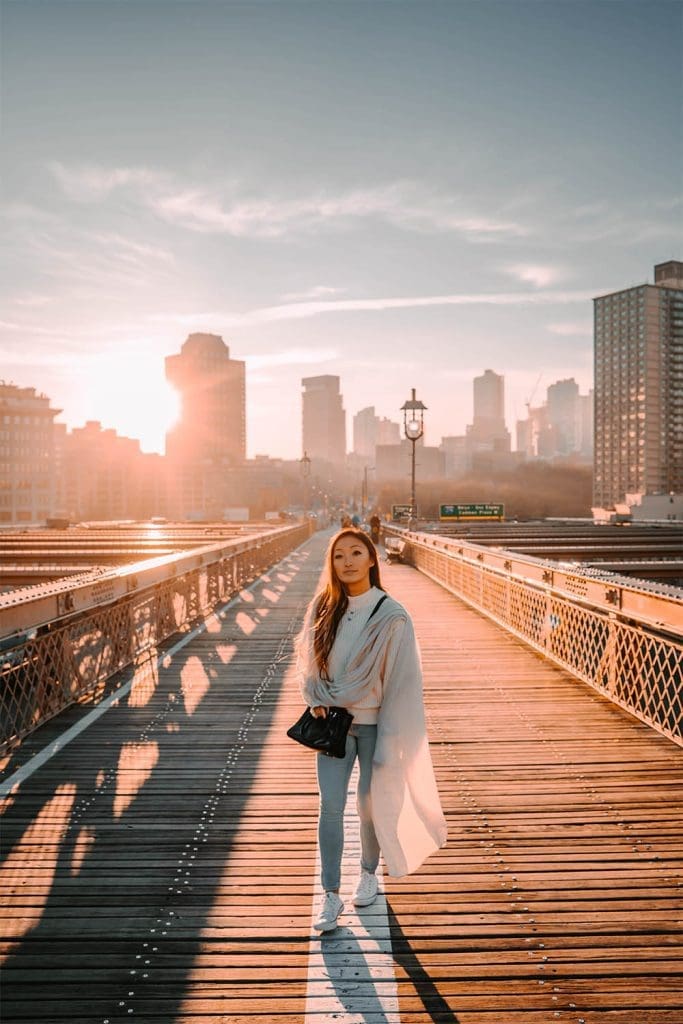 Danielle on Brooklyn bridge as the sun rises