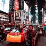 Girl standing in Times Square