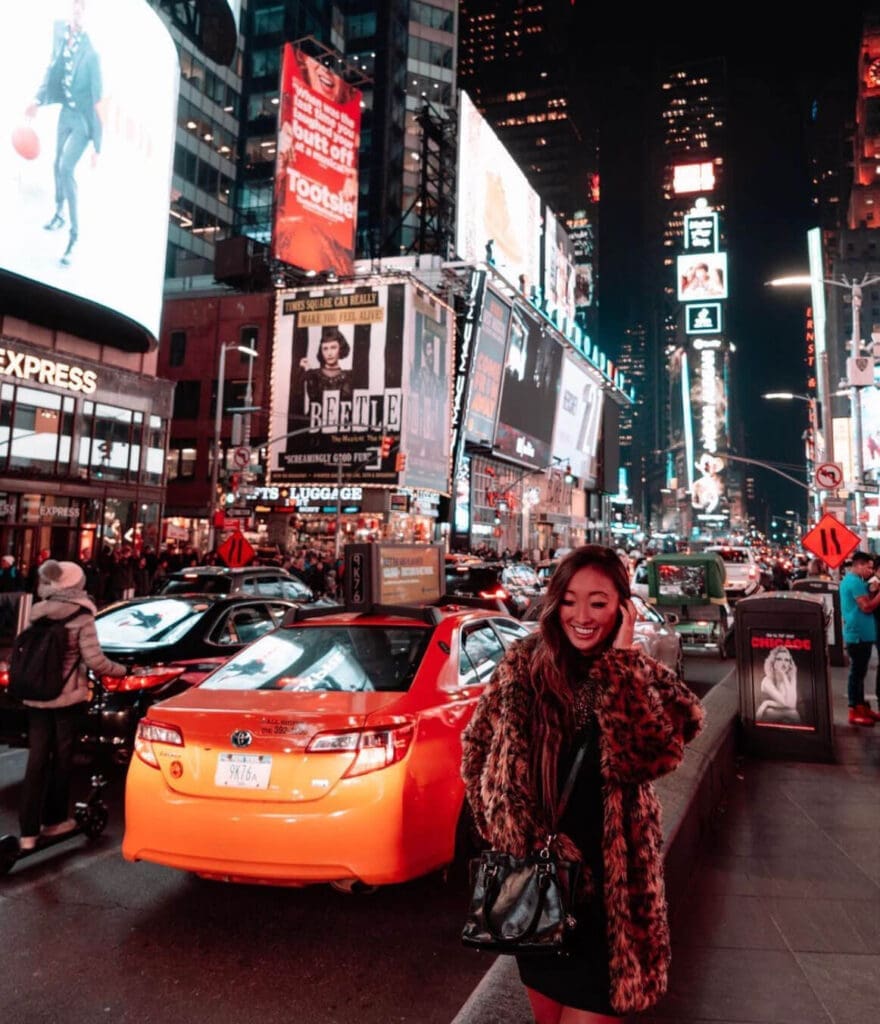 Girl standing in Times Square