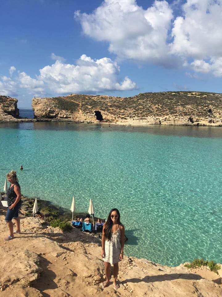 Girl standing in front of Blue Lagoon Comino Malta