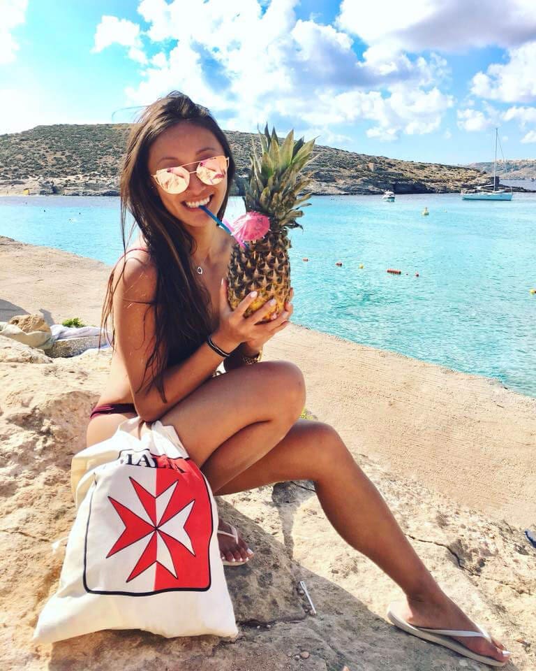 Girl holding a pineapple in Malta