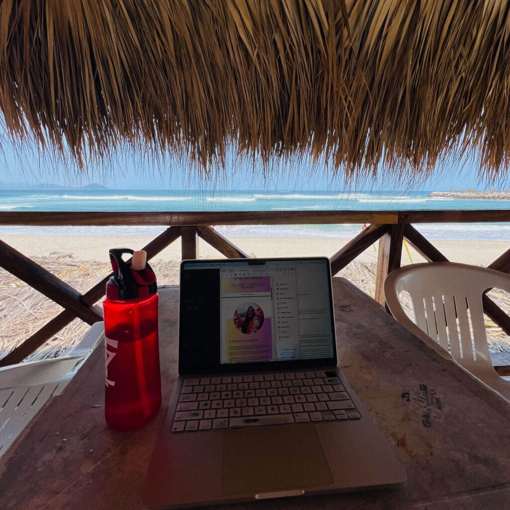 Working from rooftop palapa