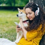 Girl with dog and headphones