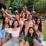 Group of 9 girls smiling at the camera