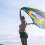 Girl holding Brazil Flag