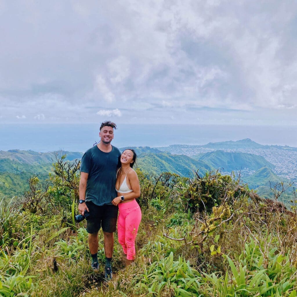 Couple on top of ka au crater in Hawaii