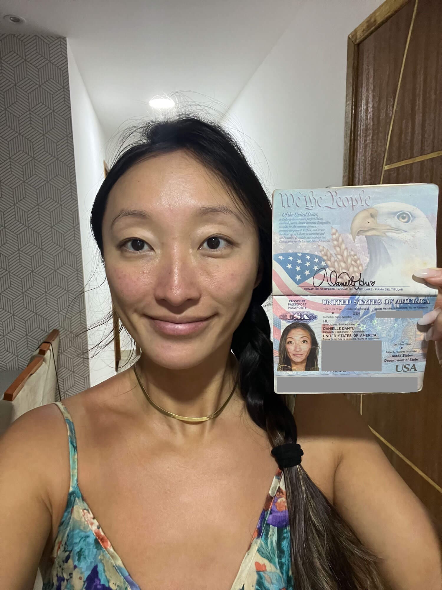 Girl holding passport taking a selfie