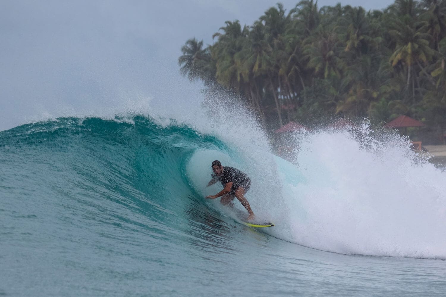 Man getting barreled while surfing